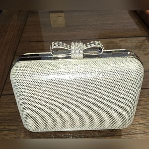 Zoe Adams - silver clutch with sparkle bow